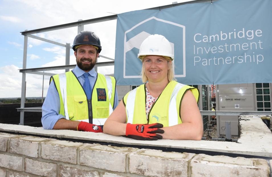 Man and woman at topping out ceremony 